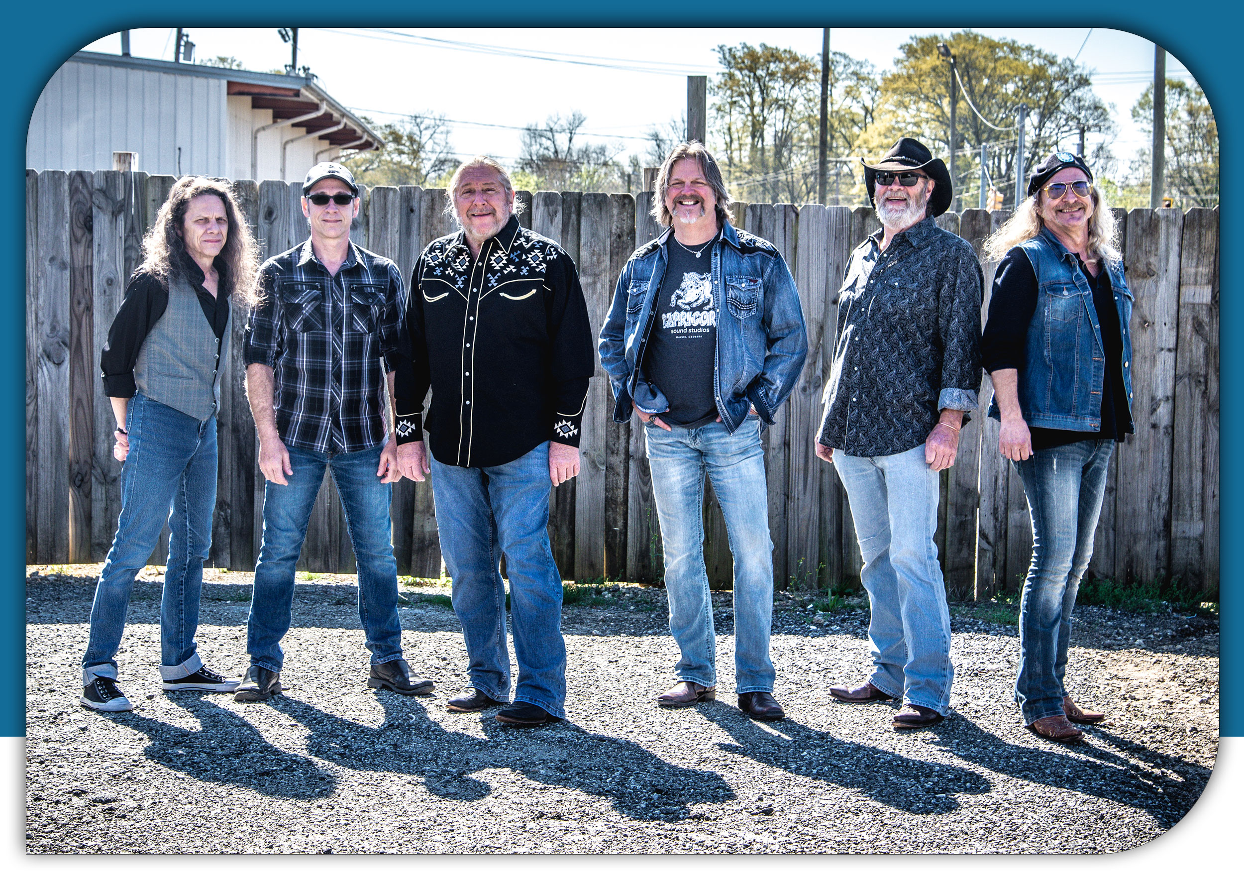 The Marshall Tucker Band image with band members in front of fence